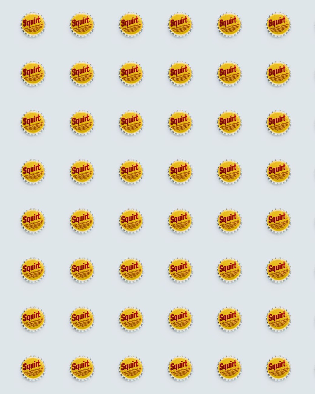 Aesthetic pattern of vintage Squirt bottle caps with a bright yellow and red design on a white background.