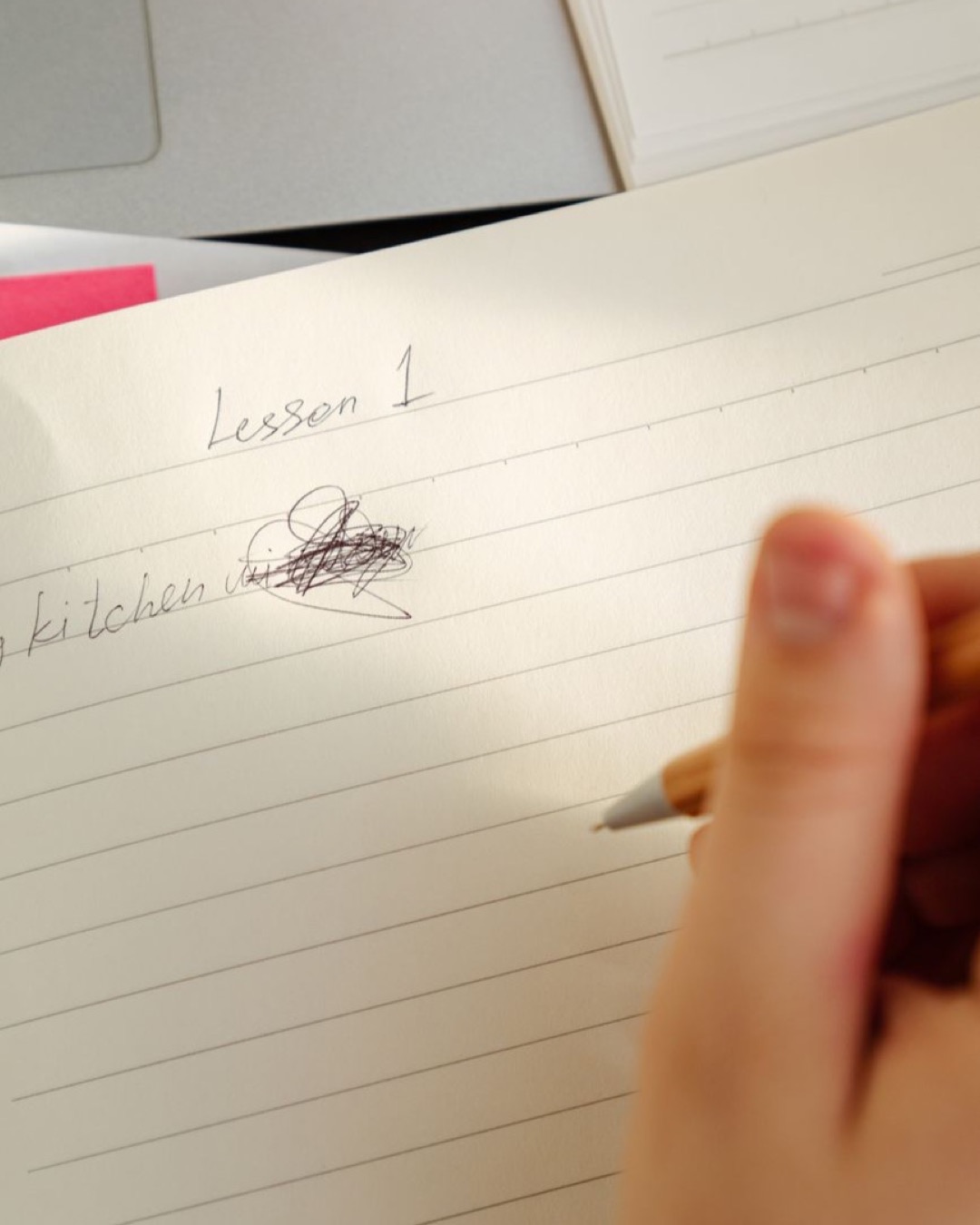 Focused shot of a handwritten lesson in a notebook, emphasizing detail and learning.