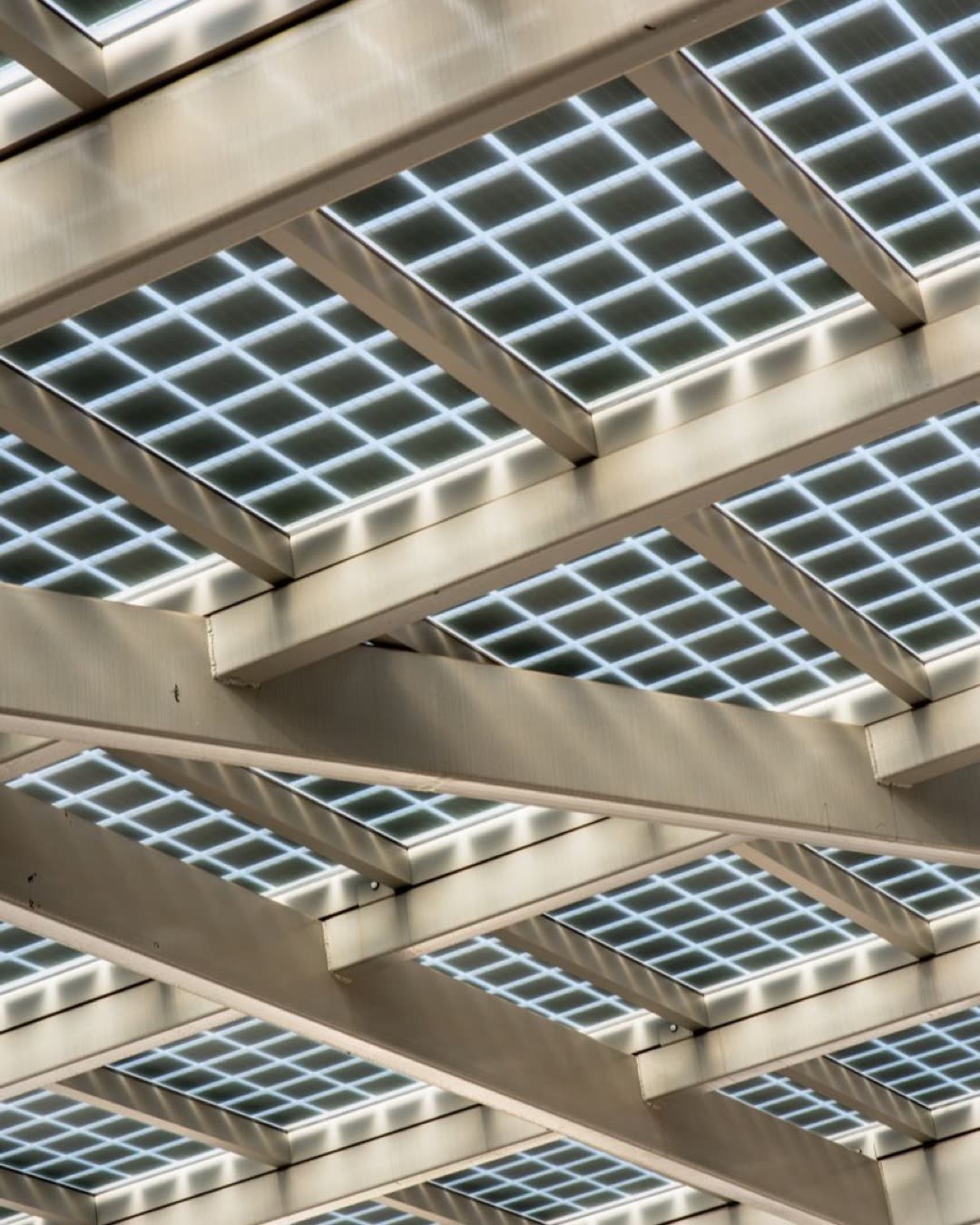 Abstract view of a modern solar panel structure with geometric patterns.