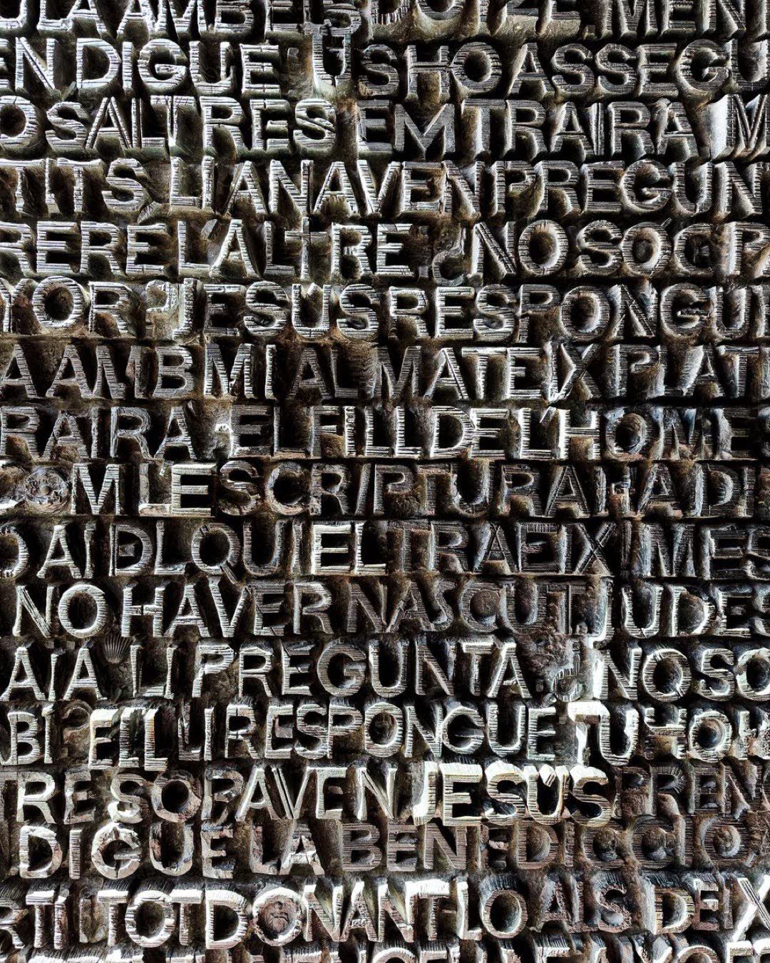 Close-up of a detailed typographic pattern on an ornate textured surface, Barcelona.