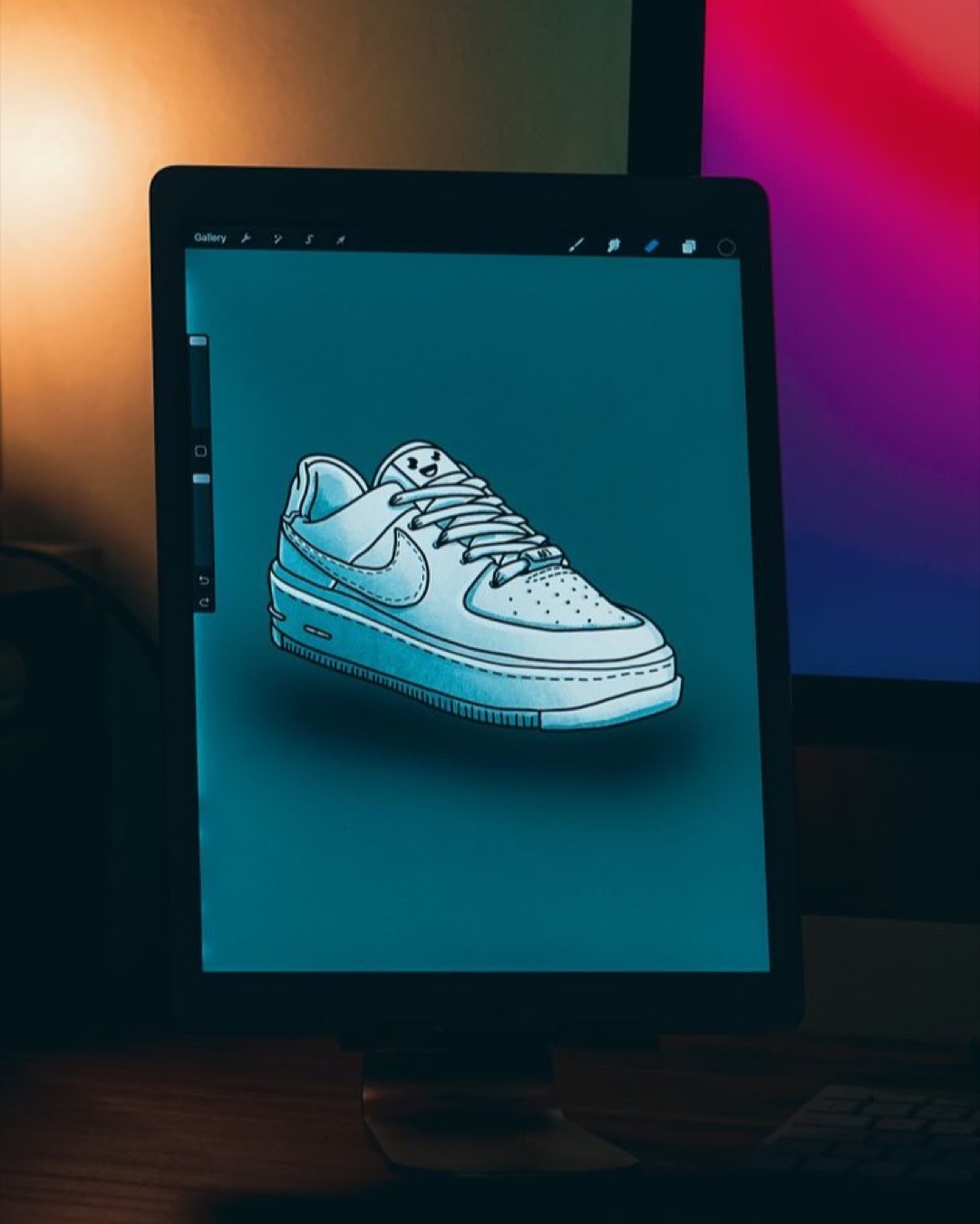 Creative digital artwork of a sneaker displayed on a tablet screen indoors.