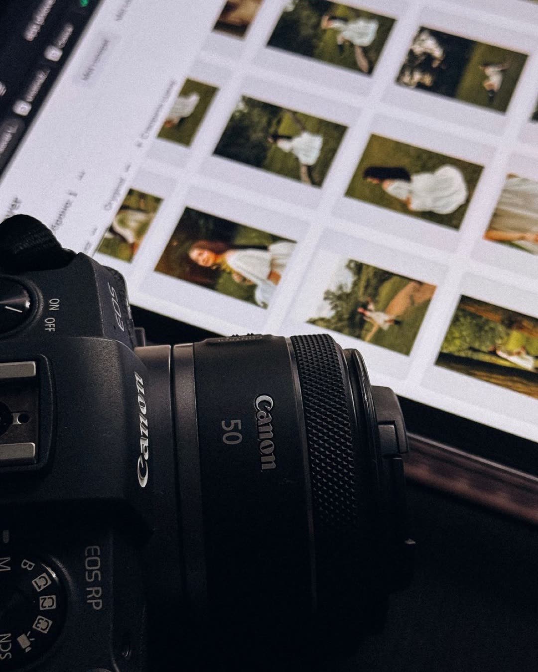 DSLR camera next to a digital screen displaying photographs in an editing software.