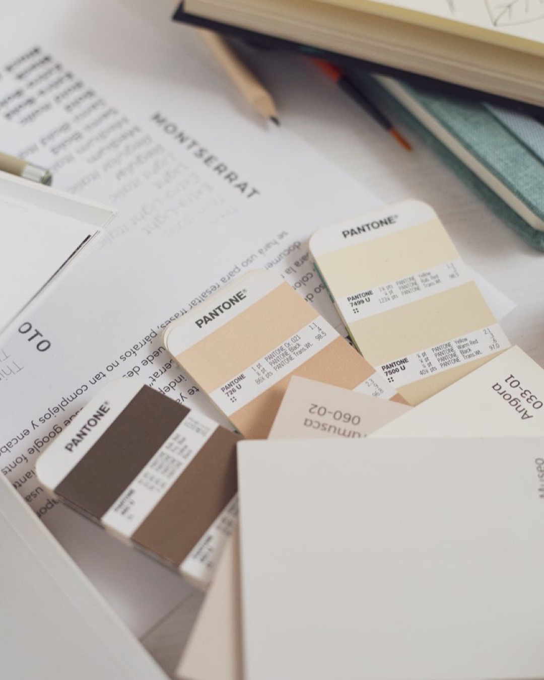 Close-up of Pantone swatches on a table, perfect for design projects.
