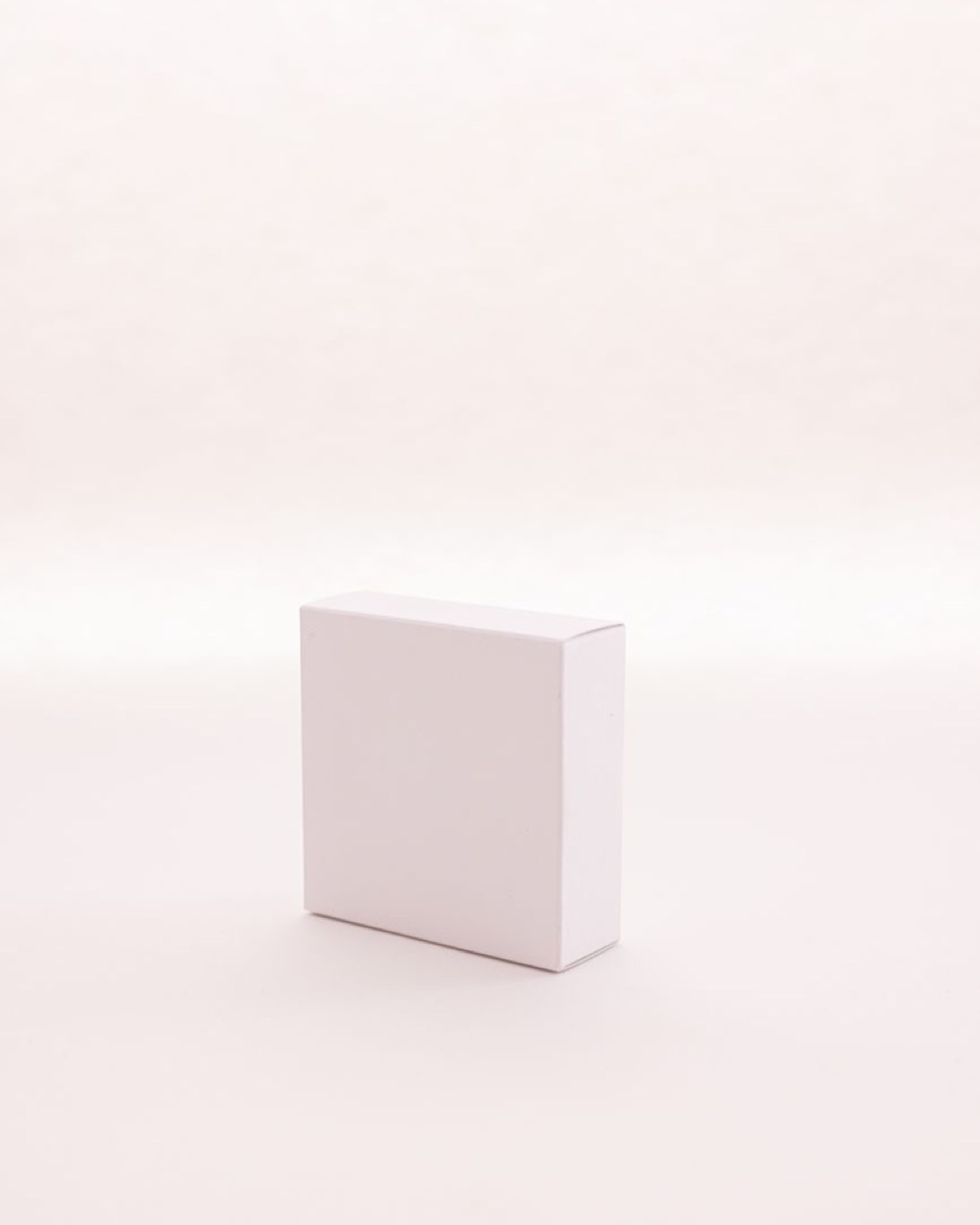 Simple white box on a soft background, ideal for product mockup or design showcase.