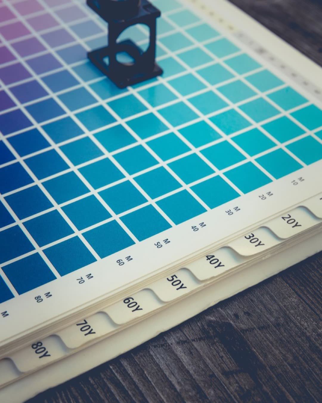 A color palette with a magnifying glass tool, ideal for design and printing work.