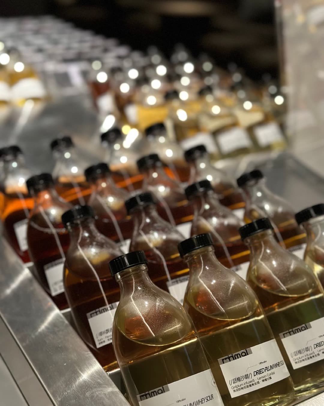 Close-up of a diverse selection of bottled liquids, captured indoors in China.