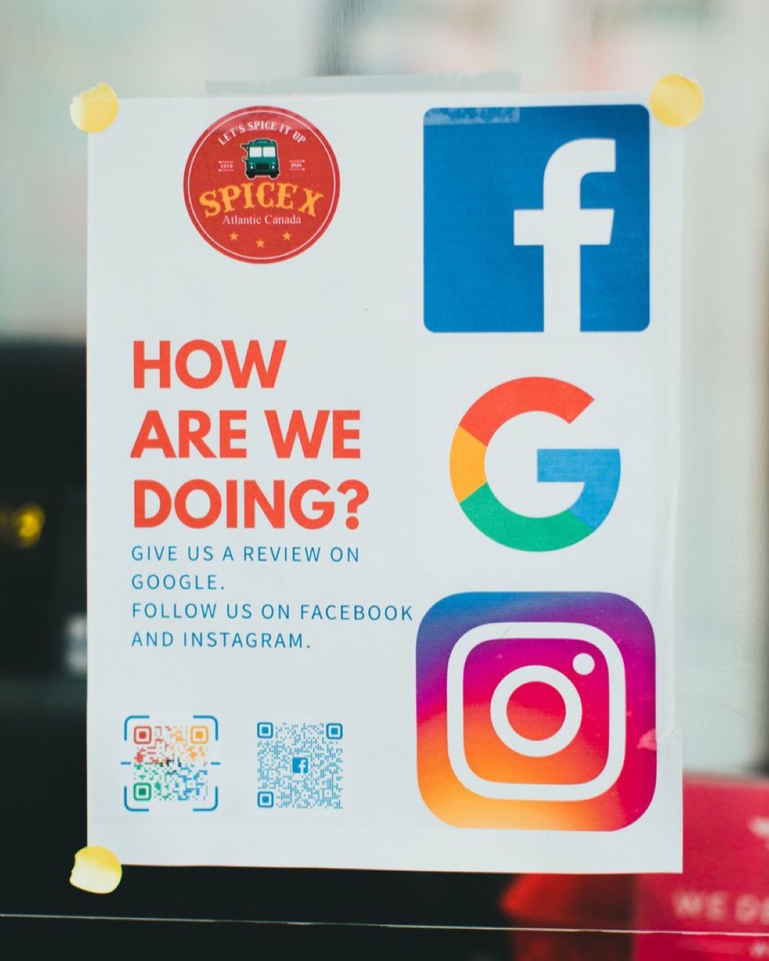 Poster encouraging reviews on Google, Facebook, and Instagram.