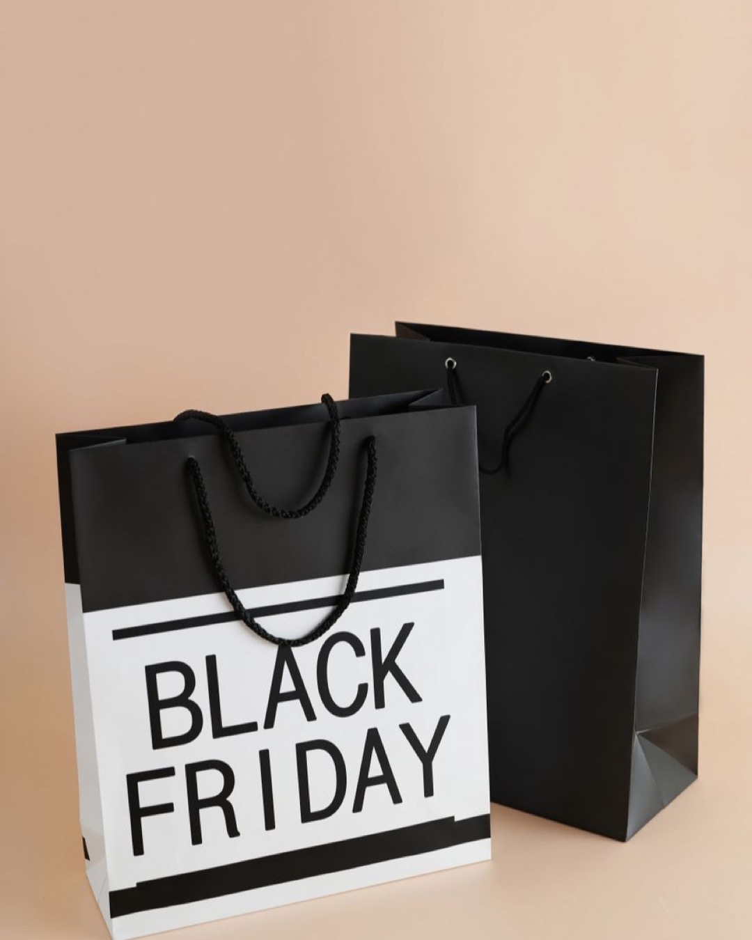 Minimalist shot of Black Friday themed shopping bags showcasing modern consumerism trends.