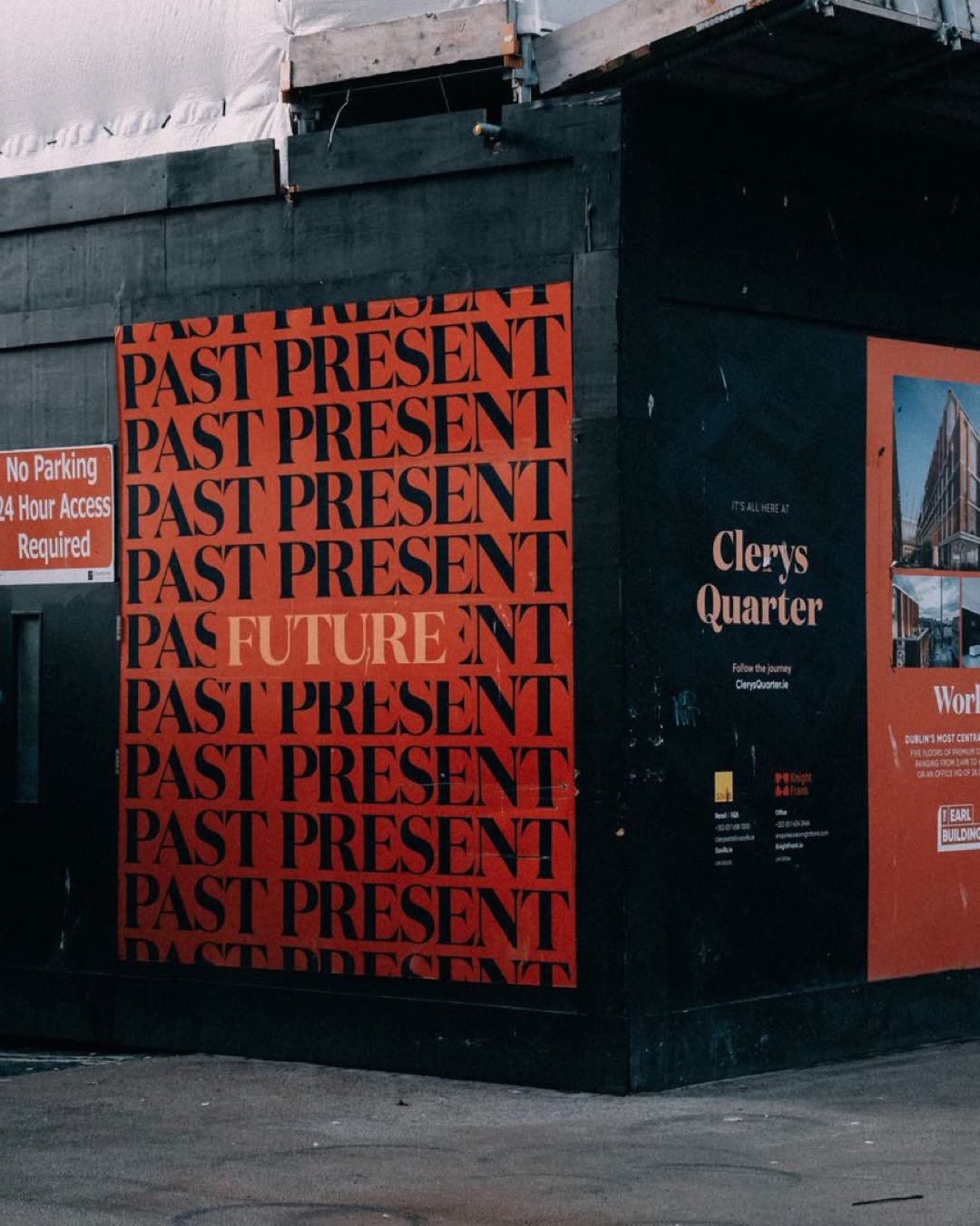 Vibrant city corner with striking 'Past, Present, Future' mural and urban signage.