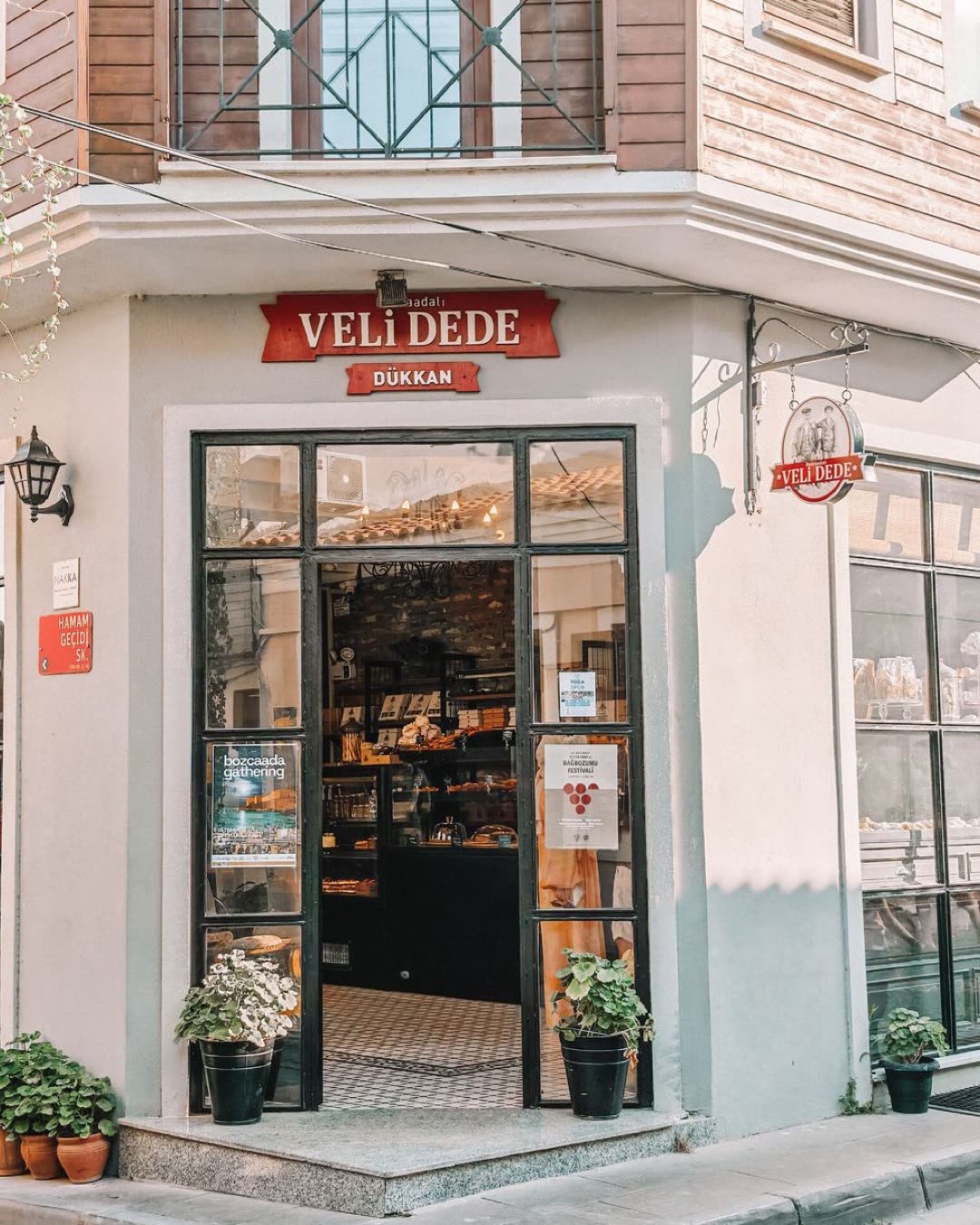 Inviting entrance of a rustic bakery shop with decorative elements on a sunny day.