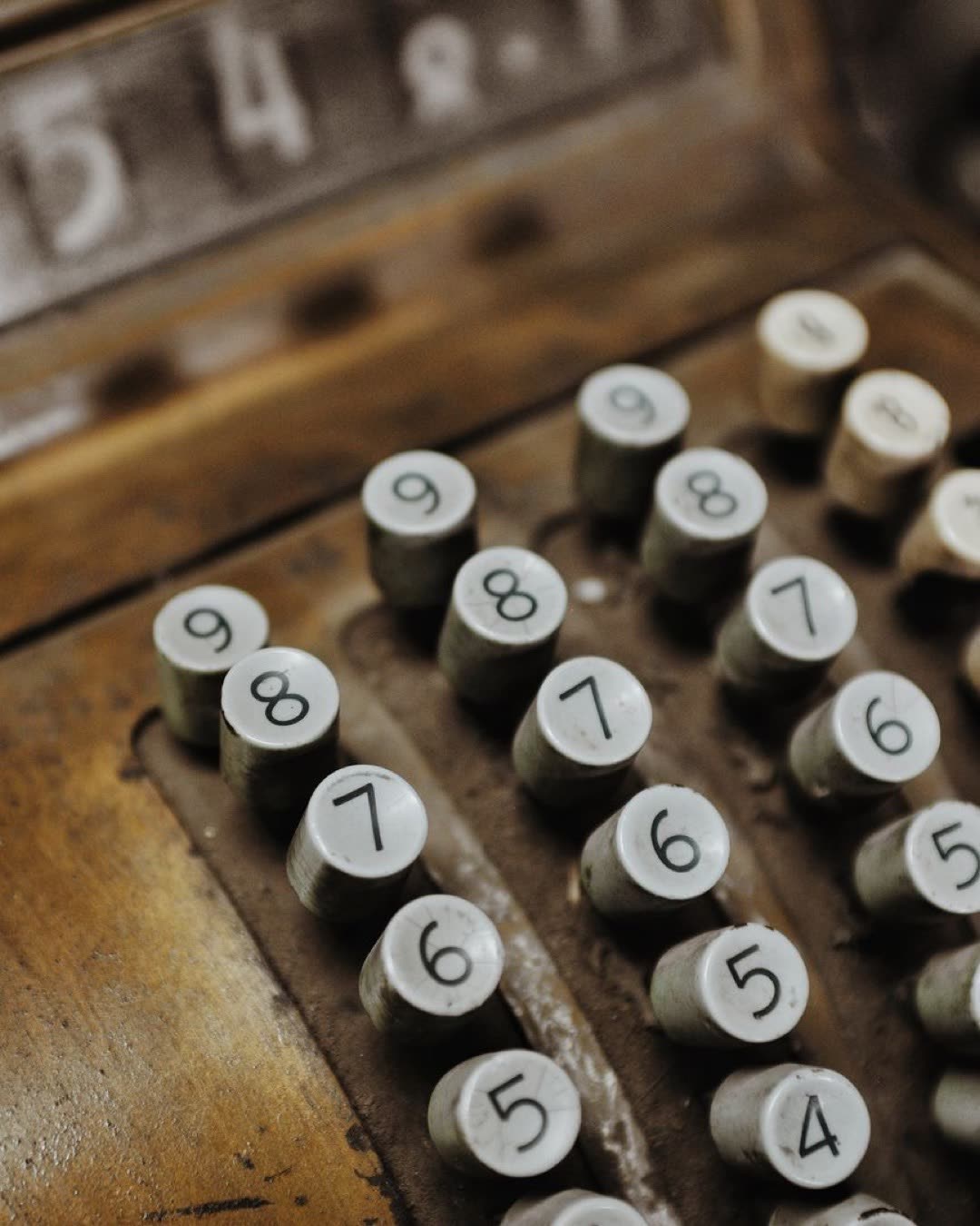 Close-up of a vintage cash register showcasing its antique keys, set in Chile.